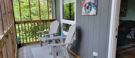 Enjoy cool mountain breezes from the screened in porch