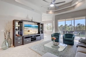 The Large TV is Located Inside of a Large Entertainment System, to the Right Will Be the In Kitchen Dining Set and to the Left is the Upstairs Landing, Dining Room and Bedroom #2 and #3 and the Second Bathroom