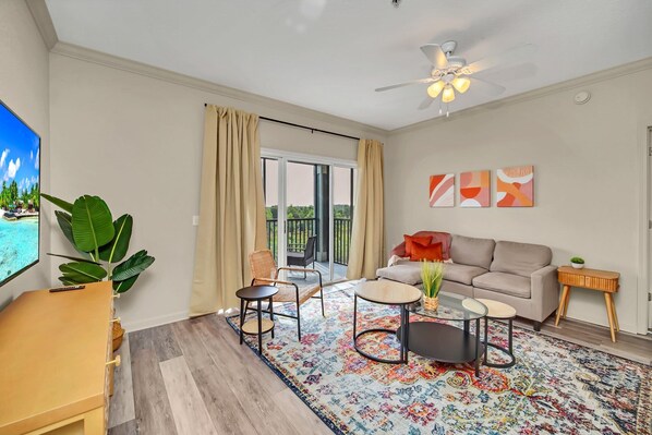 Living room with smart TV and direct patio access