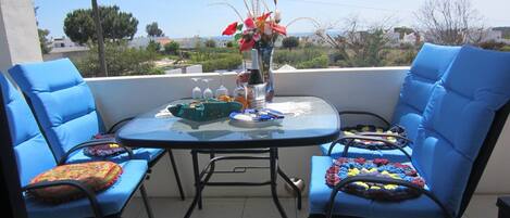 Enjoy a glass of Portuguese green wine on our sunny balcony overlooking the sea.