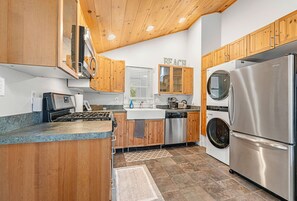 The washer and dryer are conveniently situated in the kitchen.