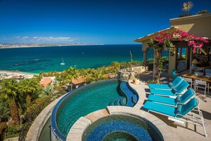 Infinity pool and hot tub with ocean and mountain views!