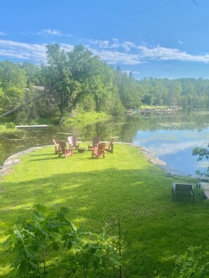 Fire pit on peninsula surrounded by water 