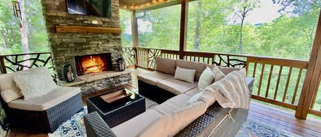 Upper outdoor deck with wood burning fireplace