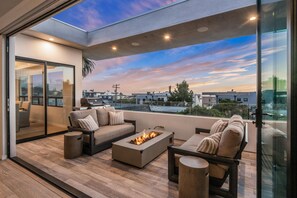 Living deck has folding doors opening into main living room 