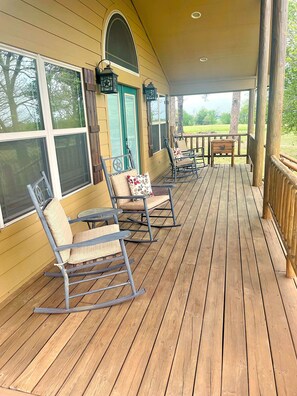 Grab you a cup of coffee and relax on the wrap around porch. 