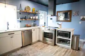 Full Residential Kitchen with Stainless Steel Appliances.