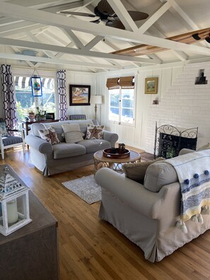 Light & open "beachy" living room with ocean views with plenty of seating.