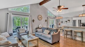 Kick back in the inviting living room with a TV and stylish décor.