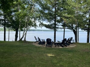 New Stone Patio around lake front fire-pit