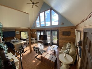 open living area with portable TV and lots of natural light