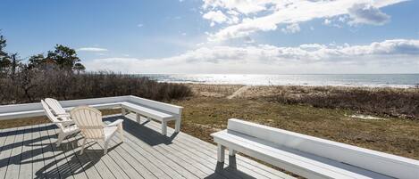 The deck with a grill, sitting area, and beautiful views of Crescent Surf Beach