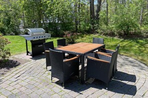 Fire up the five-burner propane grill and enjoy outdoor dining on a patio made for gathering.
