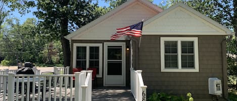 Front exterior featuring a new, large deck.