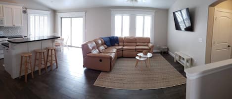 Open Living with 3 beds, 2 bathrooms, laundry, kitchen, living room, and dining.