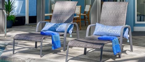 Sarasota oasis. Poolside lounge chairs. Screened pool patio.