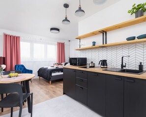 The kitchenette's practical layout maximizes space and functionality.