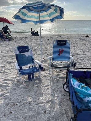 Enjoy 4 beach chairs, 2 umbrellas, cooler and a beach wagon to tote it.