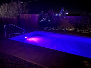 Pool and spa with color changing lights