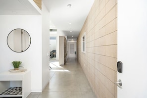 Concrete floors throughout unit & mid-century modern block walls keep unit cool.