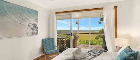 Master bedroom with access to the outdoors.