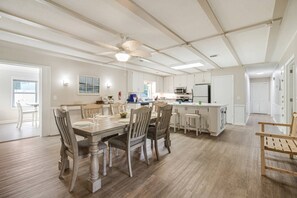 Large dining area leading to kitchen and bar