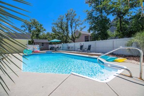 Enjoy the large enclosed back yard with pool