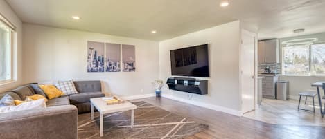 Welcome home! Spacious and open living room with big 75" Smart TV!