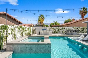 Elevated 10-person spa + 5 in-pool stools