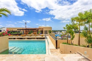 A bridge taking you across the pool to the open-air seating area