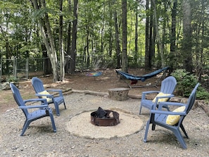 Saucer swing, hammock, and firepit for outdoor fun!