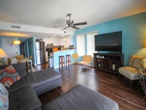 Indoors, Couch, Furniture, Flooring, Ceiling Fan