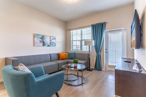 Large Sectional Sofa, LVP Flooring and Unique Décor Grace This 4th Floor Condo