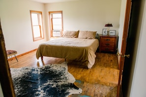 Master bedroom with king size bed and attached master bathroom