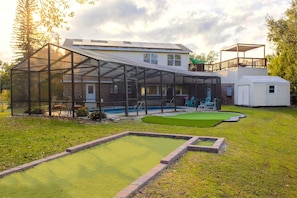 "Nice property on the lake. Putting green (they have putters), Bocce court with supplies, Screened in pool patio and Hot tub. Making memories!"- Sandy, November 2022