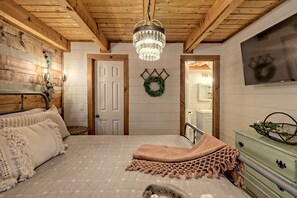 Downstairs master bedroom with king bed and attached full bath