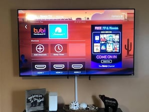 65" Smart TV in the living room loaded with cable and other apps!