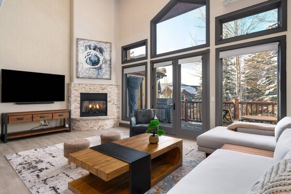 Great windows to take in the mountain views, while in front of the fireplace and big TV
