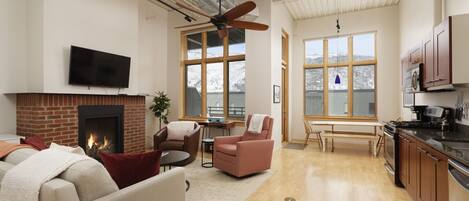 Cozy living room with floor-to-ceiling windows