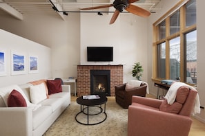 Cozy living room with TV and gas fireplace