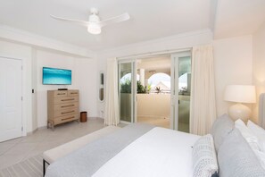 Primary Suite with king bed and television. 
