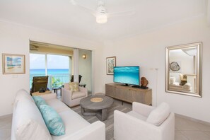 Living area with HD television and ocean views. 