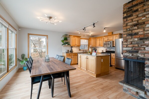 Spacious dining room in this updated Linden Hills home. Extra long dining table seats 8-10 people