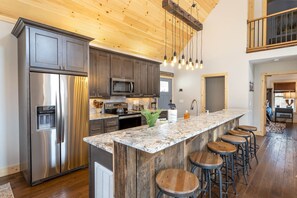 Stone Creek Cabin Kitchen with Leathered Granite Counters, Stainless Appliances