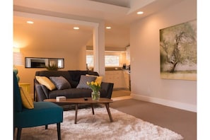 Designer furniture, custom art, adjustable lighting throughout.