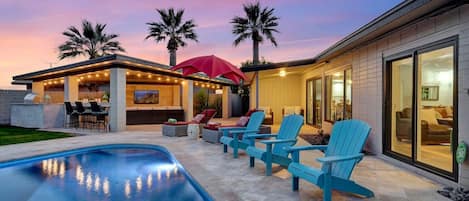 Private backyard with pool and covered patio
