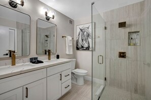 Walk-in shower with double vanity and toilet