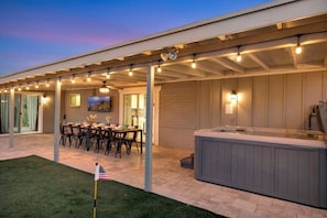 Covered patio for the dining area and hot tub