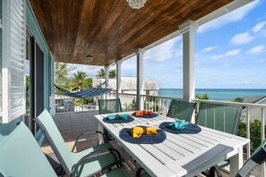 Enjoy having food and drinks on the porch as you listen to the waves.   