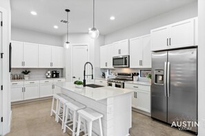 Fully equipped kitchen with all the essentials, dishwasher, and pantry